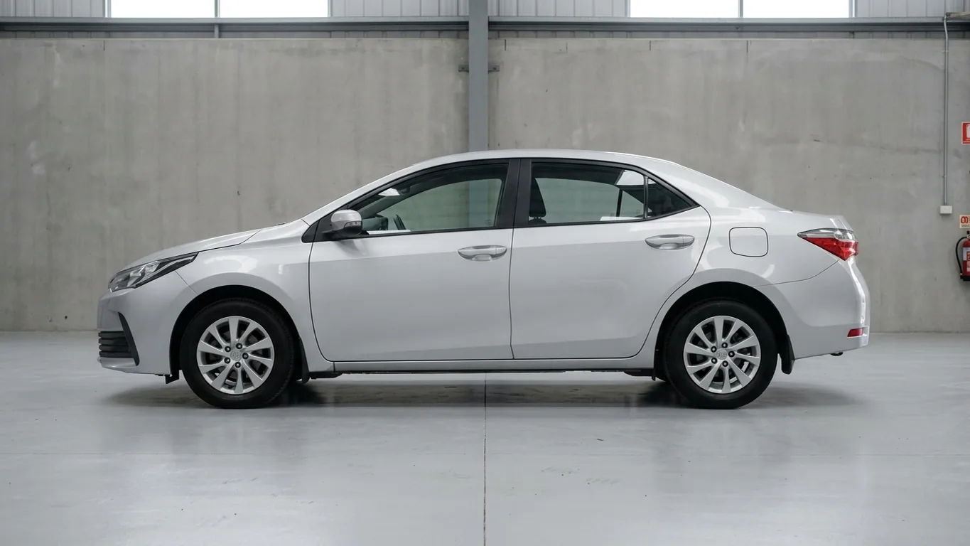 A silver Toyota Corolla saloon in the studio before its wrap
