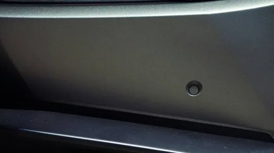 close detail of wrap work — film edge, texture or trim