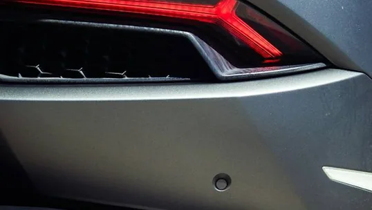 close detail of wrap work — film edge, texture or trim