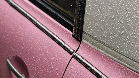 close detail of wrap work — film edge, texture or trim