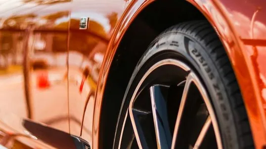 close detail of wrap work — film edge, texture or trim