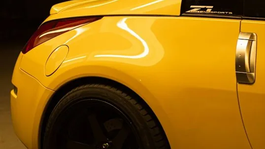 close detail of wrap work — film edge, texture or trim