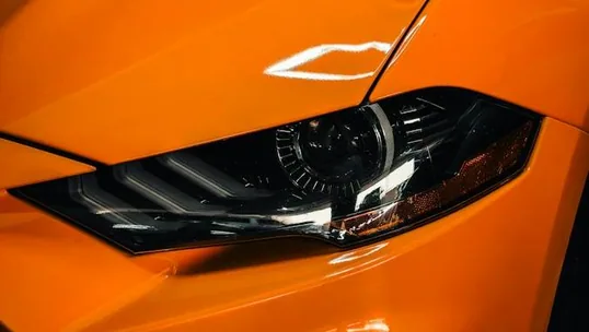 close detail of wrap work — film edge, texture or trim