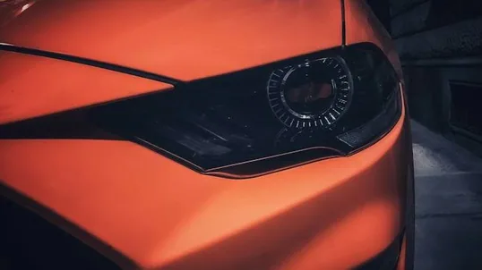 close detail of wrap work — film edge, texture or trim
