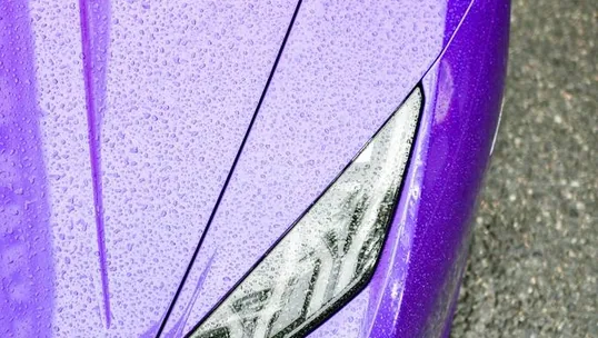 close detail of wrap work — film edge, texture or trim