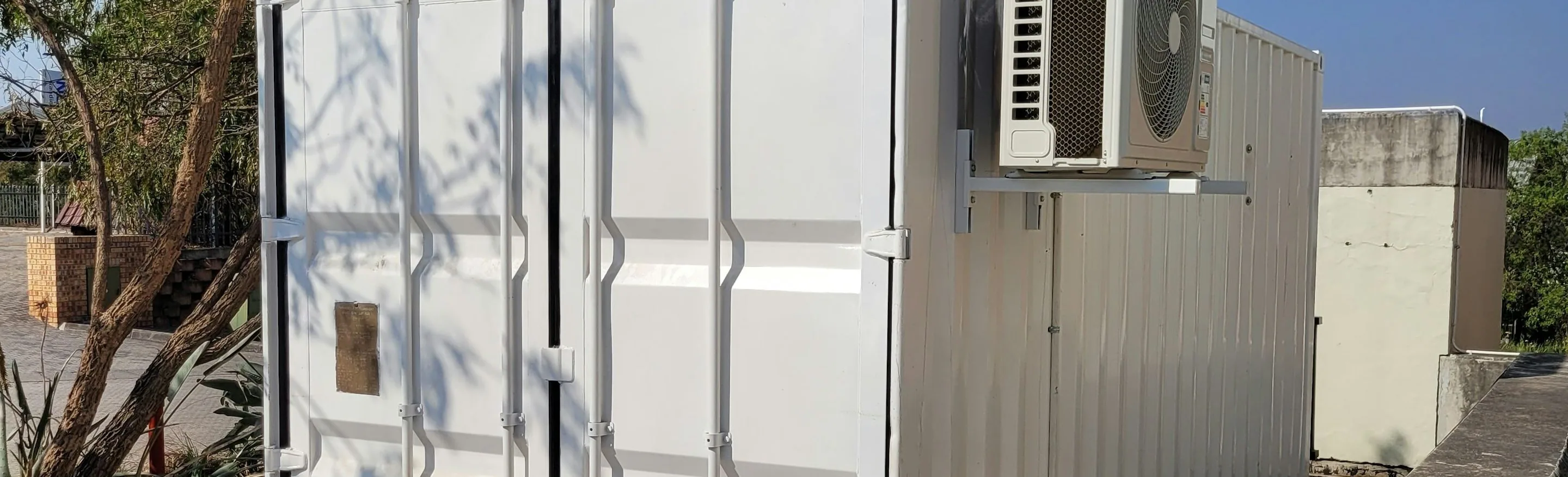 the wrap studio — a modern unit, wide, the subject in the middle third