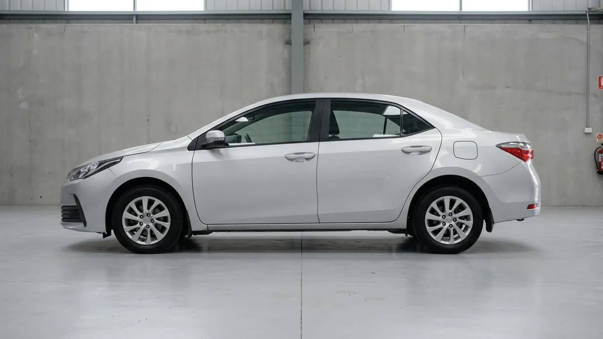 A silver Toyota Corolla saloon in the studio before its wrap