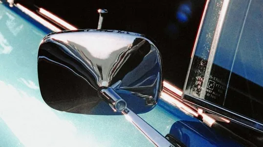 close detail of chrome delete work — film edge, texture or trim