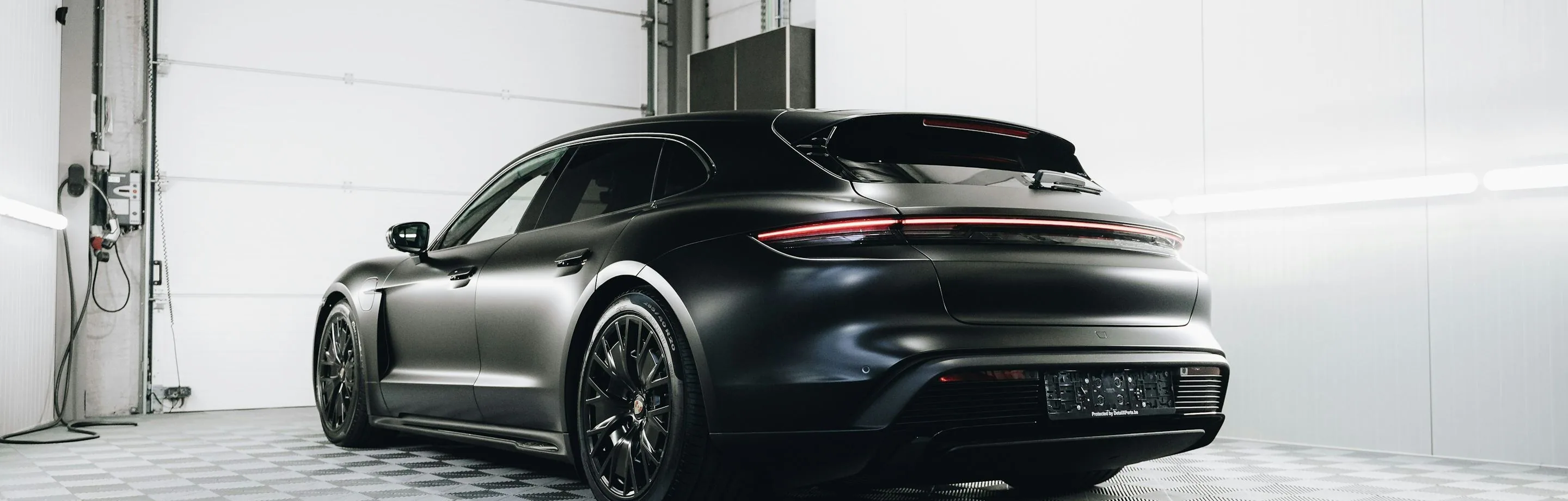 a car with blacked-out trim, low and wide