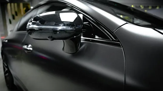 close detail of colour change wrap work — film edge, texture or trim