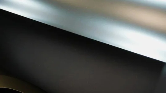 close detail of colour change wrap work — film edge, texture or trim