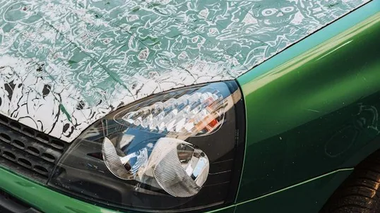 close detail of paint protection film work — film edge, texture or trim