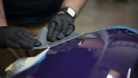 close detail of paint protection film work — film edge, texture or trim